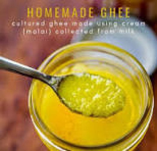 Home made fresh pure Cow Ghee prepared through traditional hand churned method with wooden churner.